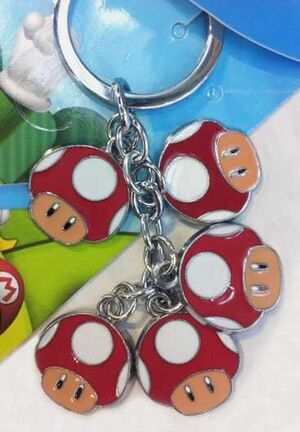 SUPER MARIO BROS LLAVERO METALICO SETAS                                    